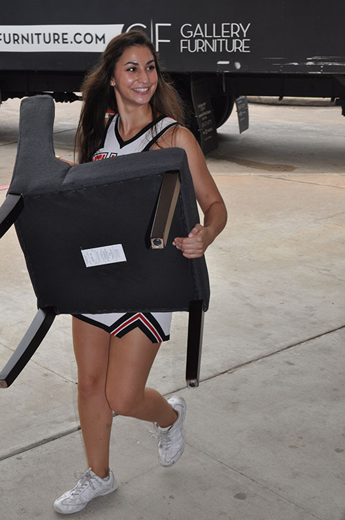 Cheerleading+captain+Elise+Pantazis+helps+with+delivering+the+furniture+donation