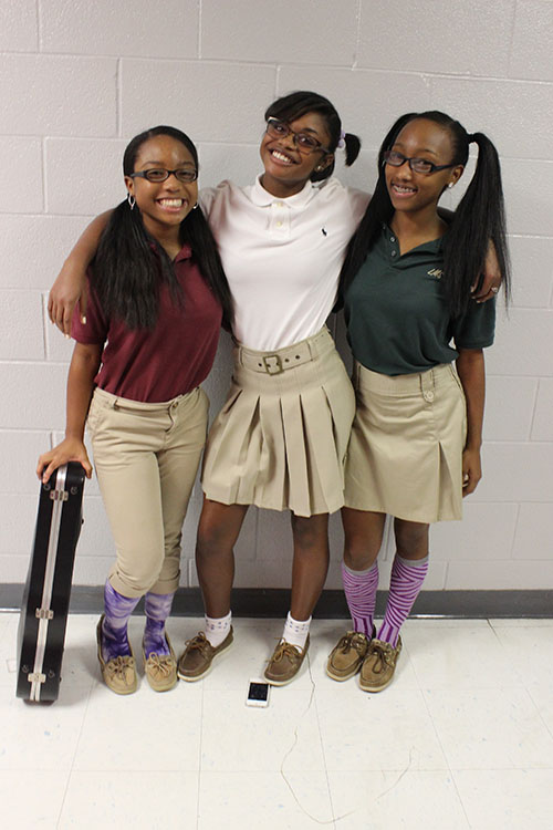 Freshman Morgan Hunter, Junior Mattison Sims, and Senior Maya Hunter flaunt middle school uniforms.