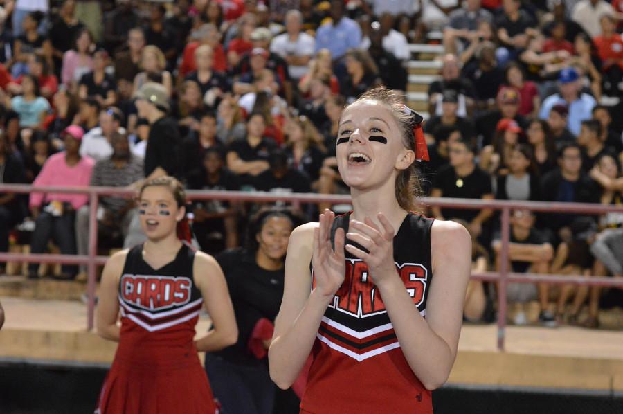 Varsity cheerleader Elizabeth Howes excites the crowd.