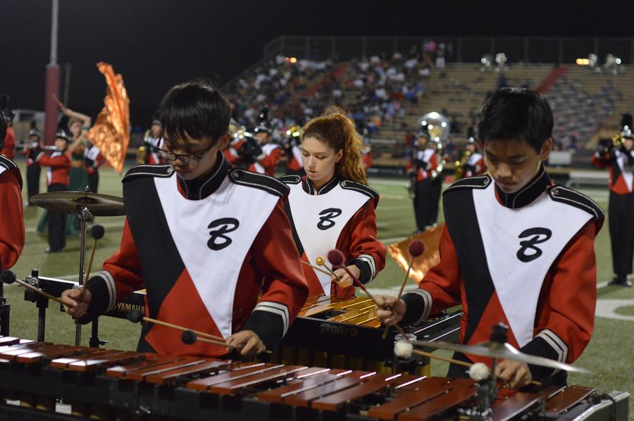 Cardinal Band members play the xylophone during half-time. 