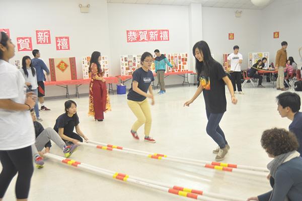 Students participate in traditional Chinese game. 
