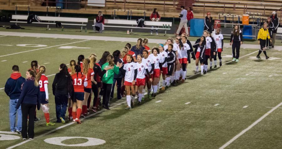 Lady Cardinals show their post game sportsmanship.