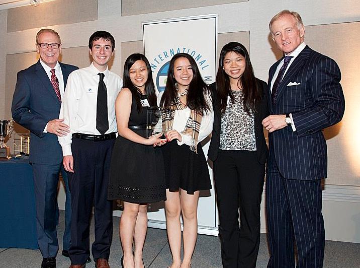 Ted Strickland (far left) and William Brewer (far right) present (from left to right) juniors Liana Wang, Amber Liu, Christina Tan and senior Aaron Birenbaum with their Elite 8 award at the Council of Foreign Relations.