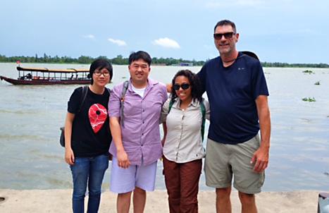 (From left to right): Le Khanh-An (cousin of Quan Ngo), Quan Ngo, Matthew Olsen, Anita Page await to board their boat on their trip down the Mekong Delta south of Saigon, Vietnam.