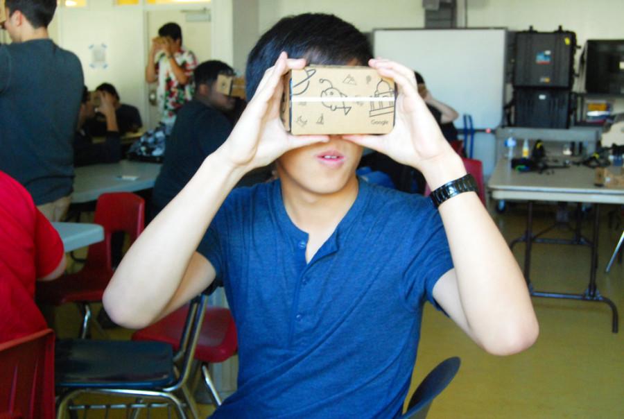 Senior Daniel Liu explores the surface of the moon with Googles virtual reality goggles.