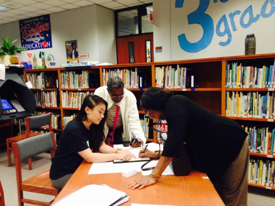 Students from Government classes help register voters on election day