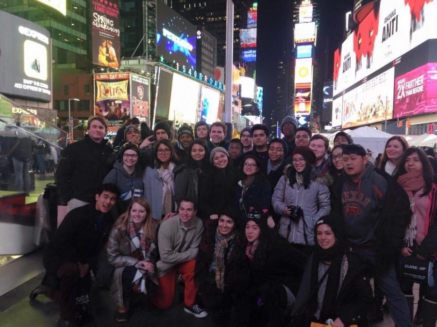 Seniors cluster in Times Square for a photo on Close Up trip