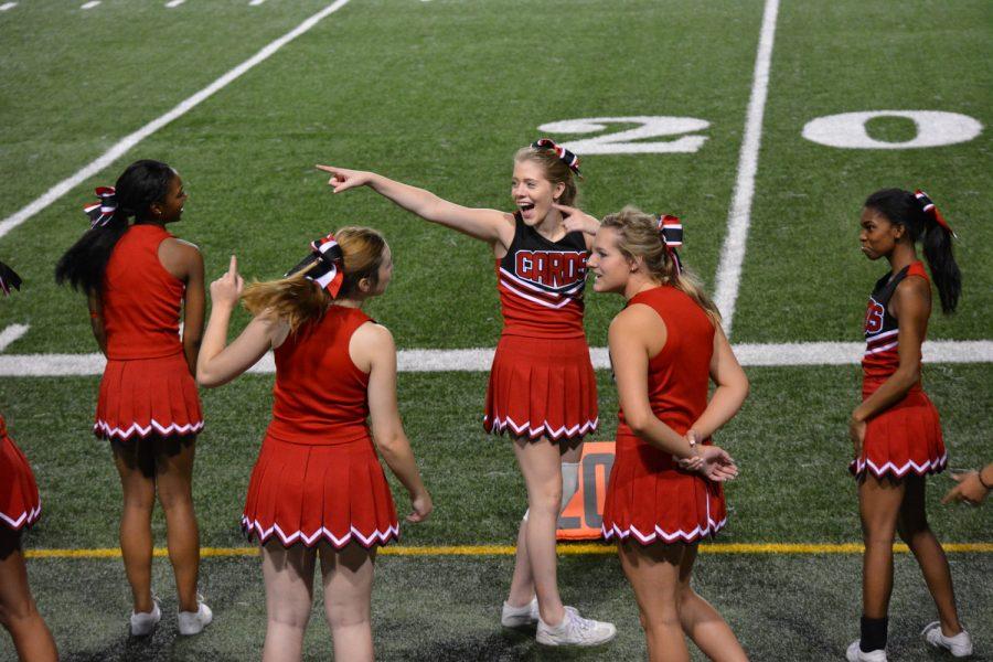 Cheerleader Senior Gillian Connely works to pump up the crowd.