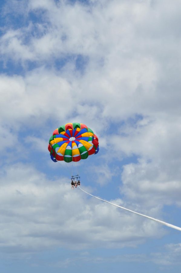Junior Adam Remels in the action of parasailing.