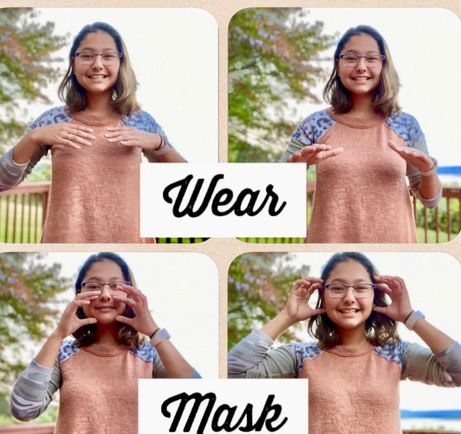 Lia Hatvany communicates Wear a mask in American sign language. 