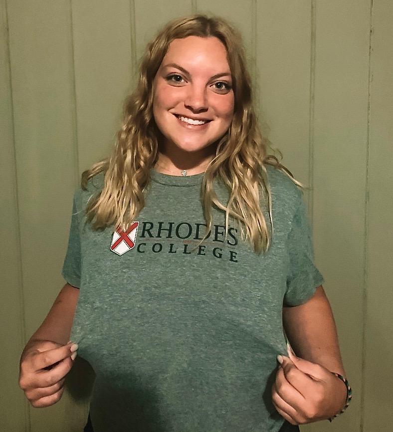 Sami+Ferguson+shows+off+the+shirt+she+received+from+Rhodes+College.+