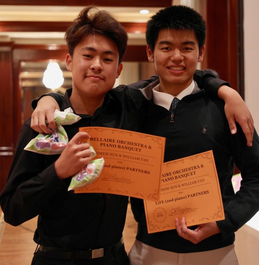 Andrew Sun (left) and William Fan (right) pose with their duet certificates at the Bellaire Piano Banquet. 