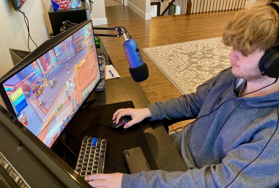 Sophomore+Jacob+McMorris+enjoys+playing+video+games+from+his+at-home+gaming+setup.+One+of+his+favorite+games+to+play+alone+or+with+friends+is+World+of+Warcraft.+