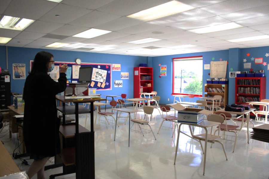 English teacher Jennifer Blessington teaches to an empty classroom. Normally classes in Bellaire could have up to 30 students per room. Now they have about 1 to 5.