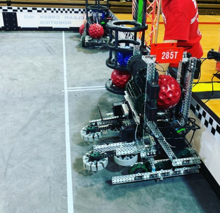 Robotics club president Jimmy Xi prepares the robot for the VEX AI competition. The team plays under the team 285T, and the goal is to make the robot complete various tasks autonomously.