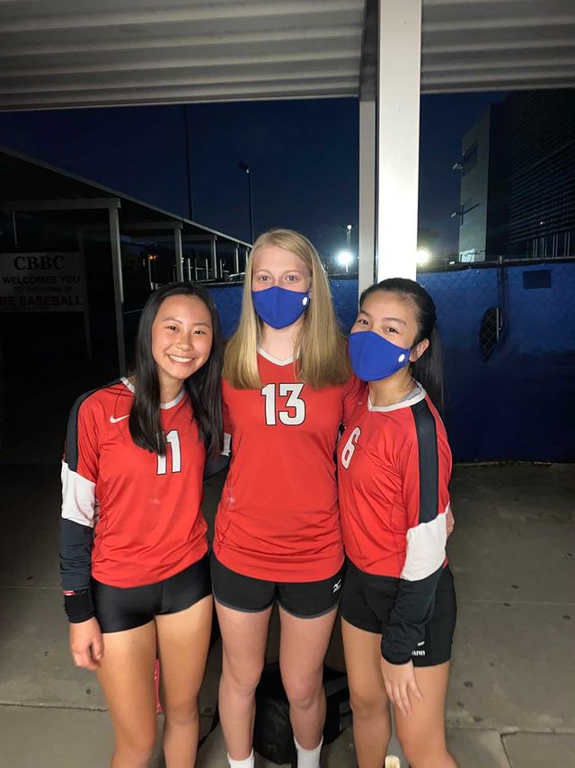 Chen (left) plays with Camille Lasics and Kylie Nguyen in her last game of the season with the freshmen volleyball team, which consists of seven members, the smallest team she has ever been a part of. The group went undefeated in district and clinched the district title.  
