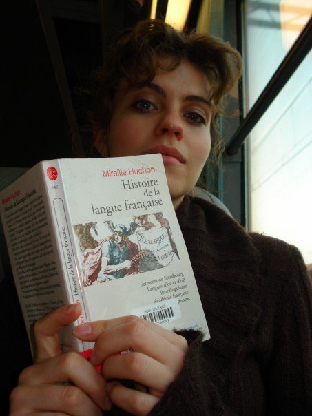 Annilee Newton reads about the history of the French language while traveling on the tram from La Source to Orléans Centre Ville. 