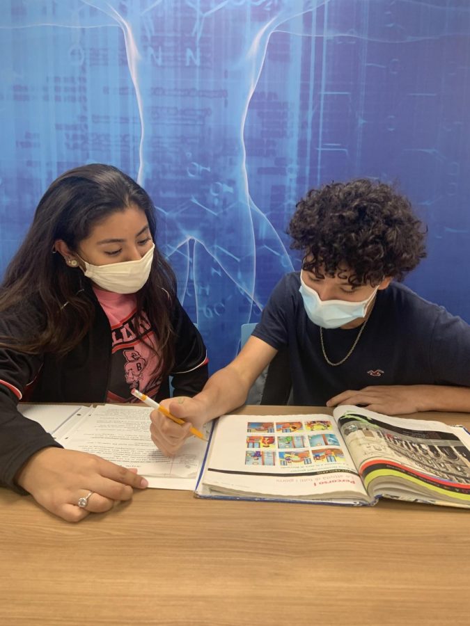 Junior Ivanna Gonzalez and freshman Ian Alecio study for an upcoming Italian test. Alecio considers his cousin Gonzalez as a role model.