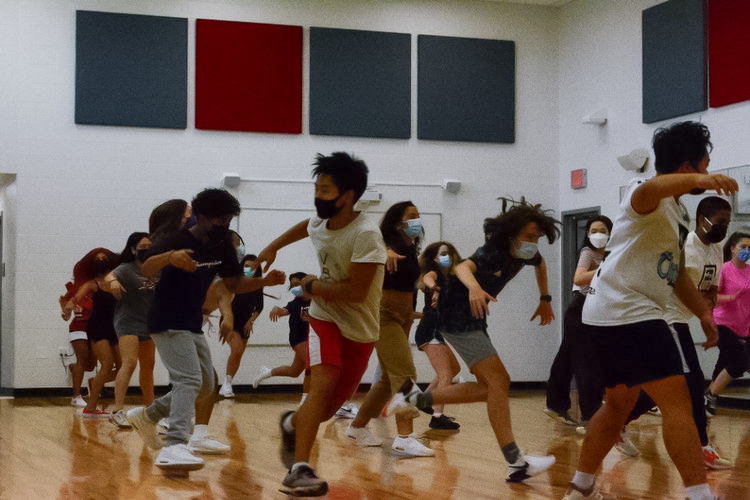 The eMotion Hip-Hop dance section practice for the upcoming fall show this Nov. 19 in room 2205. Junior EJ Brotamonte choreographed this routine.