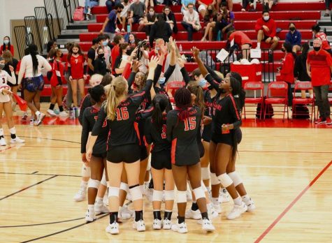 Celebration erupts as the girls volleyball team beats Brazoswood 3-1 in preseason play. Preseason has helped the girls prepare for the season.