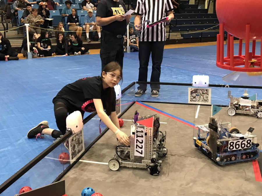 Maggie Schwierking demonstrates her creation at a Robotics competition. Schwierking plans on using her knowledge from Robotics in college, as she majors in engineering.