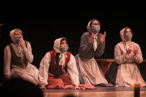 During a courtroom scene, Abigail Williams (second to the left, played by Ria Nanjundan) and her friends, act as if they have seen a spirit. Nanjundan says she knew she wanted to play Abigial the moment Red Bird announced they would be producing the crucible and screamed when she saw she got the part. We havent been able to do a lot of live theater this past year, Nanjundan said. So seeing a show that I really love come alive has just been amazing.