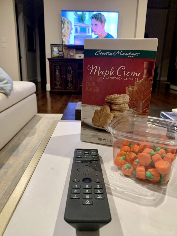 Junior Sara Wolf relaxes for a long movie night watching Cocktail followed by Risky Business. She sets out her favorite fall snacks including maple cookies and pumpkin chocolates.