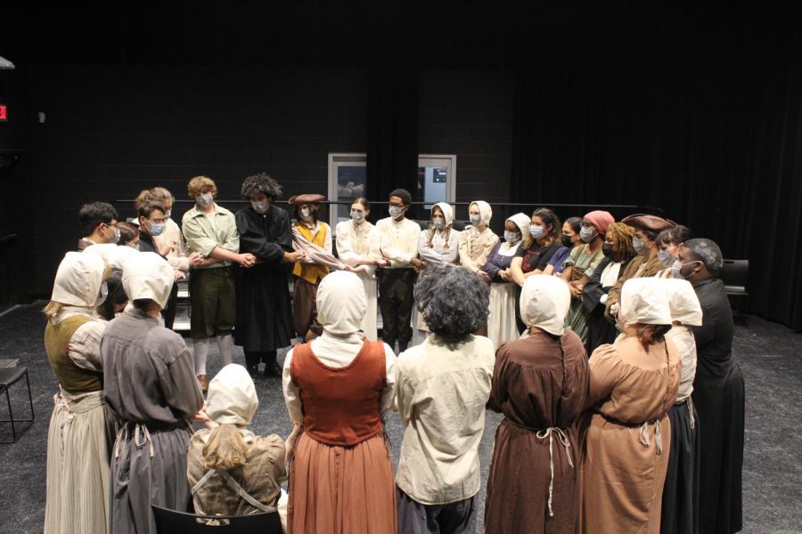 The cast of the Crucible gathers in a show circle before the Friday night performance. Ria Nanjundan, one of the leads, says show circle is supposed to build confidence before the show and make the theatre department feel closer.