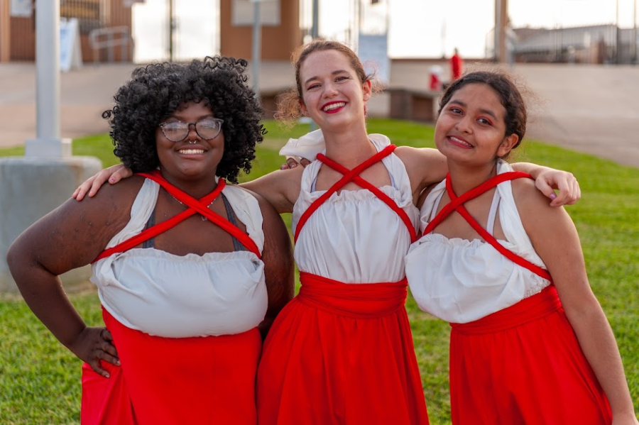 Co-Captains Jasmin McGee, Larissa Hawker and Lucia Callejas (from left) perform alongside the Mighty Cardinal Band at a UIL Marching Band Competition on Oct. 30, 2021. The team received a score of three '2's' according to the UIL's scoring rubric.