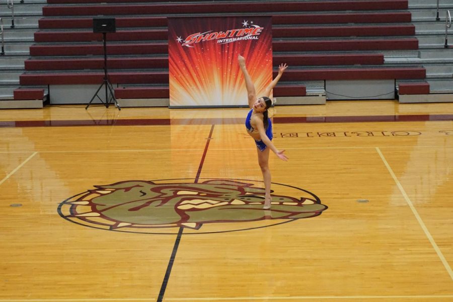 Senior+Bella+Mansfield+performs+her+solo+at+her+last+high+school+competition.+She+hopes+to+continue+dance+in+college.
