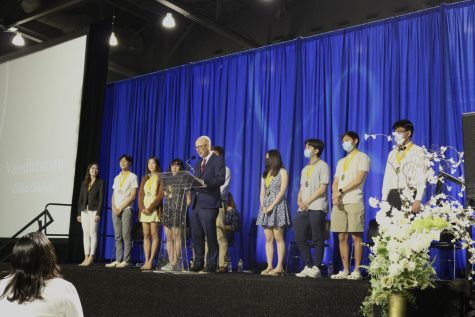 Principal Michael McDonough presents 9 of the senior classs 13 valedictorians at the HISD Scholars Recognition ceremony at Delmar Fieldhouse on Apr. 12. McDonough announced the future college plans of each student to the audience.
