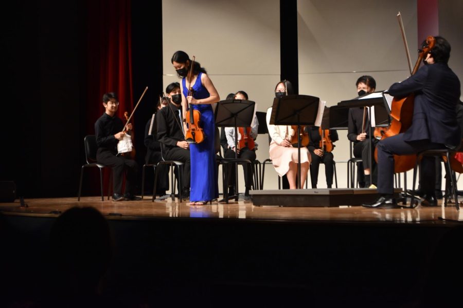 Vice+President+and+senior+Heather+Gan+takes+a+bow+after+the+completion+of+the+concert.+Gan%2C+the+violin+section+leader%2C+led+the+violins+in+their+performance+of+Encanto%2C+Cello+Concerto+Mvt.+1+%26+2+and+The+Magical+World+of+Pixar.