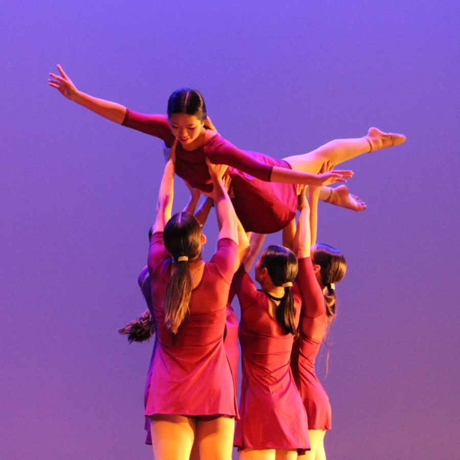 Current and next year’s dance officers perform the new and old dance “Love in the Dark.” Current colonel and senior Bella Mansfield, captain and junior Laura Cheng, sophomore Elizabeth Burres, captain and senior Morgan Lawter and sophomore Sydney Fell hold up sophomore Chloe Chang.