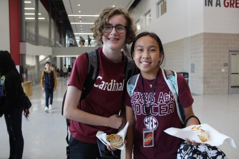 On the way back from a club meeting, freshmen Meadow Iam and Maisie Moncrief show off their maroon shirts. Not only did their maroon shirts show their support for Uvalde students, but it also represented a school team. 