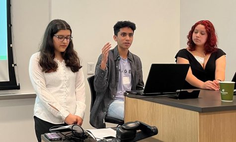 Varun Manickam (11) speaks about his goals for the climate community alongside Anika Shethia (12) and Grace Cruz (11). They present in auditorium 108 of Glasscock School of Continuing Studies at Rice.