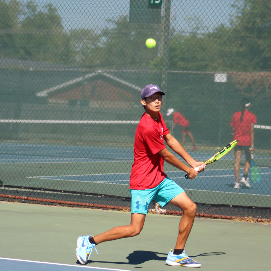 Sophomore Winston Ma prepares to hit a backhand during his singles match. Ma plays tennis for Bellaire, but attends Debakey High School.