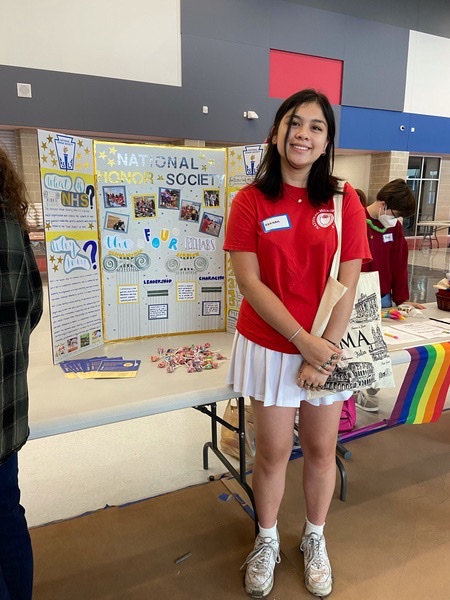 Hannah Goodwin represents NHS as its president, standing ready to recruit new members. She is also an officer in DACA and BPA.