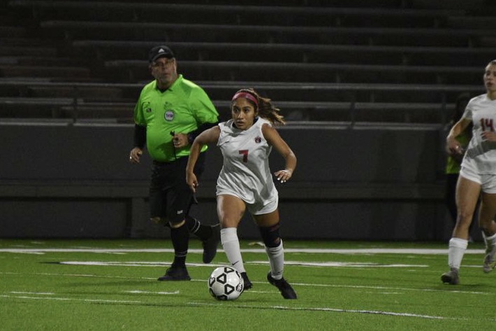 Moments before her teammate receives the ball, Castro aims at the perimeter. Her strategy against Cy Creek involved unpredictable shots and quick footwork to get the ball past defense.
