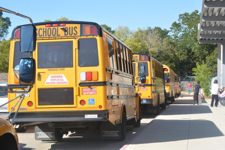 School+buses+line+up+in+front+of+the+school%2C+ready+to+pick+students+up+after+school.+They+start+lining+up+at+the+beginning+of+seventh+period.