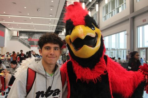 Student asks for a photo with the mascot during lunch. As a senior, itll be the mascots last year.