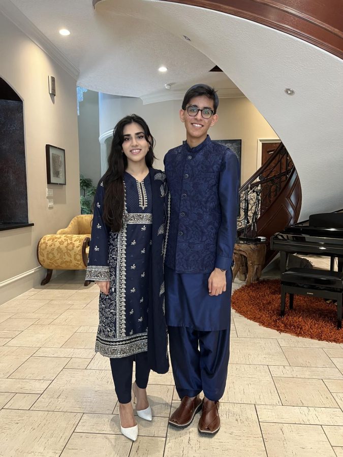 Sami Hasnie stands inside his house with his sister. Hasnie said he wants to take advantage of [his] American education and go back [to the UAE].