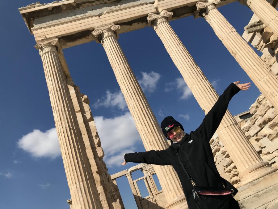 The group went on hikes to see the ancient ruins last spring break. Here, [Include grade level and full name] Matta poses with the Acropolis of Athens.