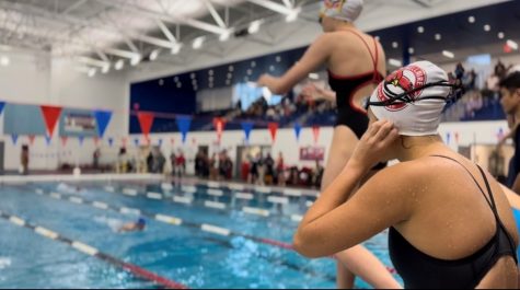 Senior Victoria Allen prepares to do a relay dive for the 200 freestyle relay. Allen also swam in the 200 Medley relay, as well as the 50 and 100 freestyle