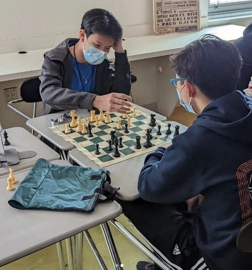 Sophomore Andy Shen plays sophomore Feifan Liu in a friendly chess game during a club meeting. Due to increasing time commitments from other school activities, Shen has less and less time to play at tournaments and instead, keeps up his skill by playing friendly matches at school during club meetings. (Photo provided by Andy Shen)