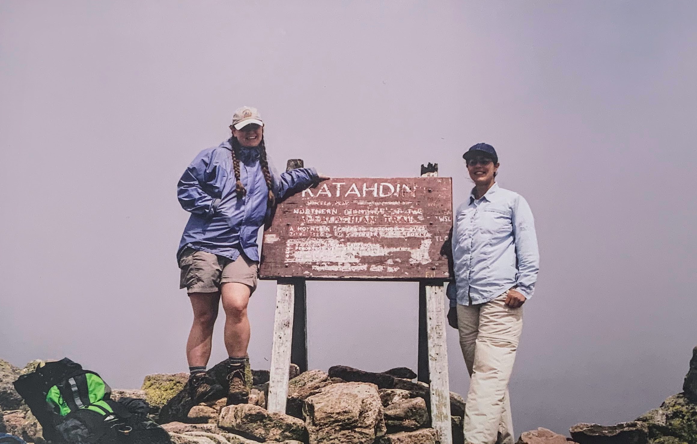 English III teacher Brownfield (left) poses on top on Mount Katahdin in Maine in 2005. It was on her descent from this mountain when she began to experience shooting pains in her back.