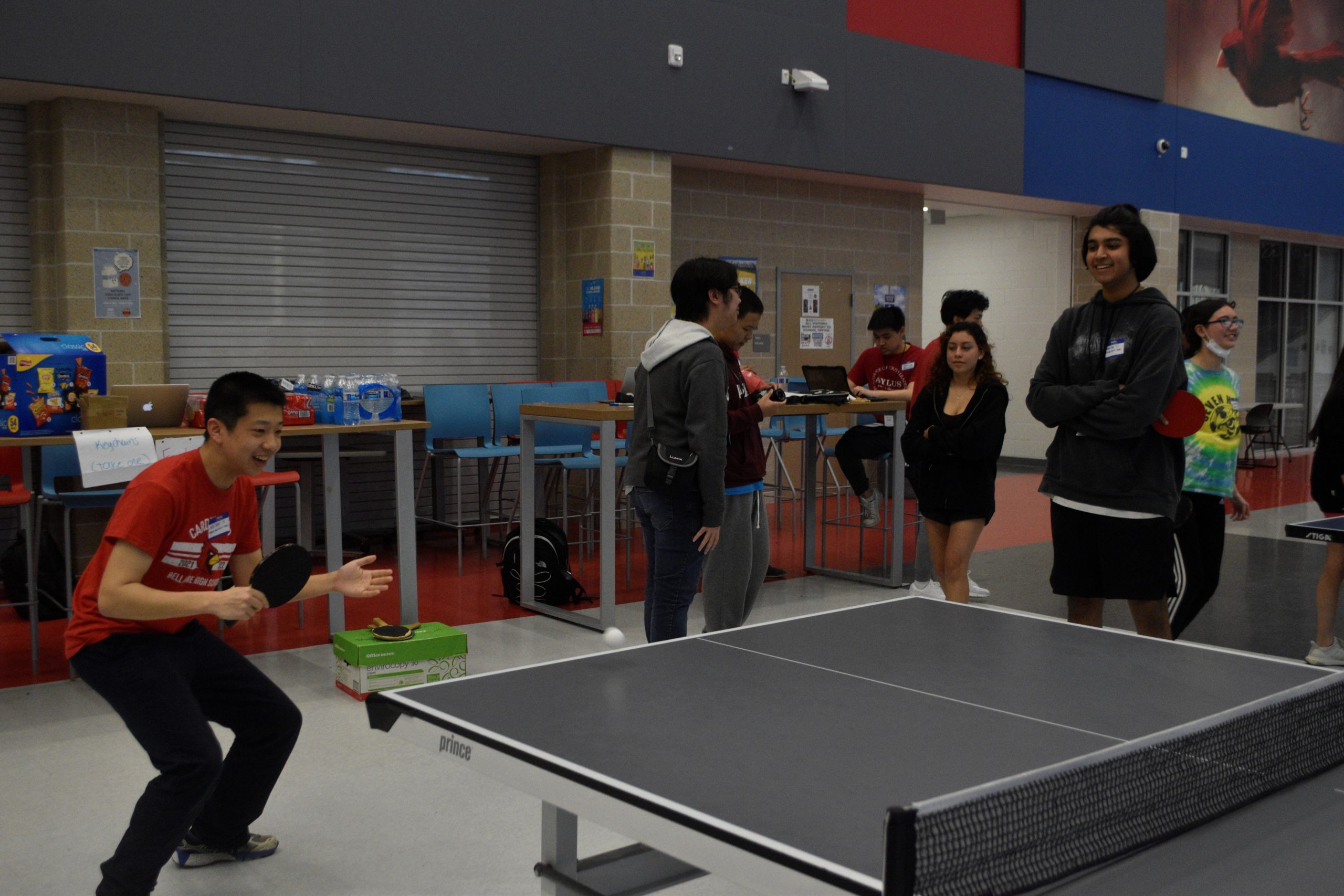 Sophomore Alex Tang plays in a singles round on March 9. His partner, sophomore Pranay Passi, stood on the side coaching him while watching the match.
