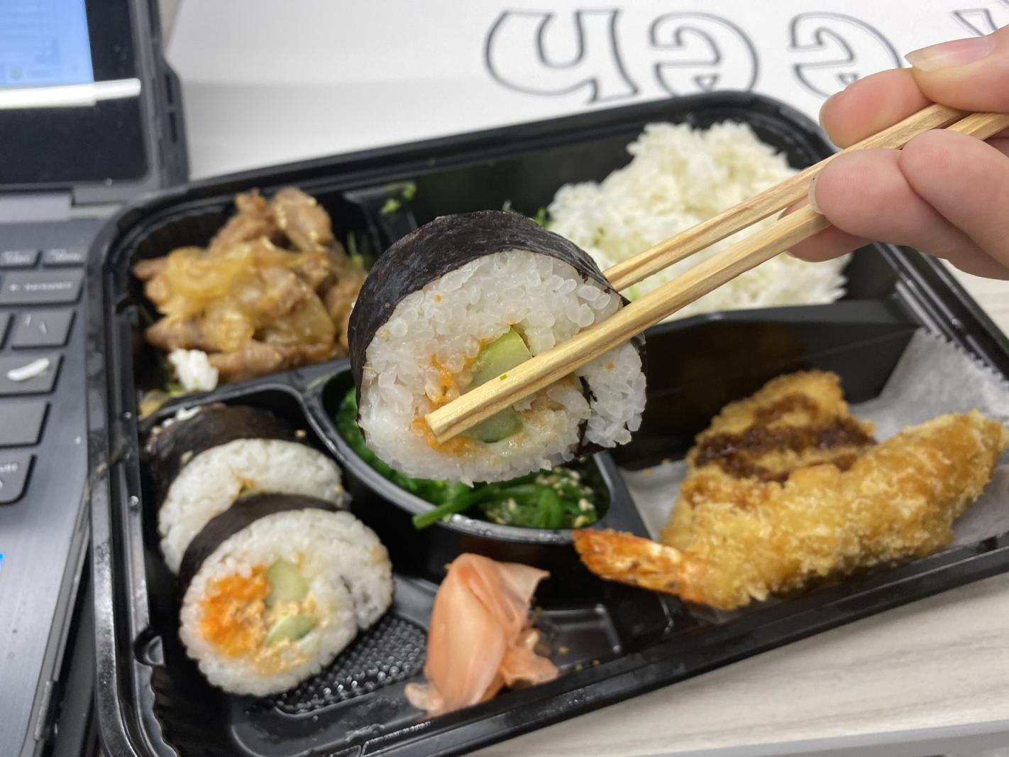 The chicken bento box contained a variety of foods, including sushi and rice. The Japanese Club sold over 200 bentos.