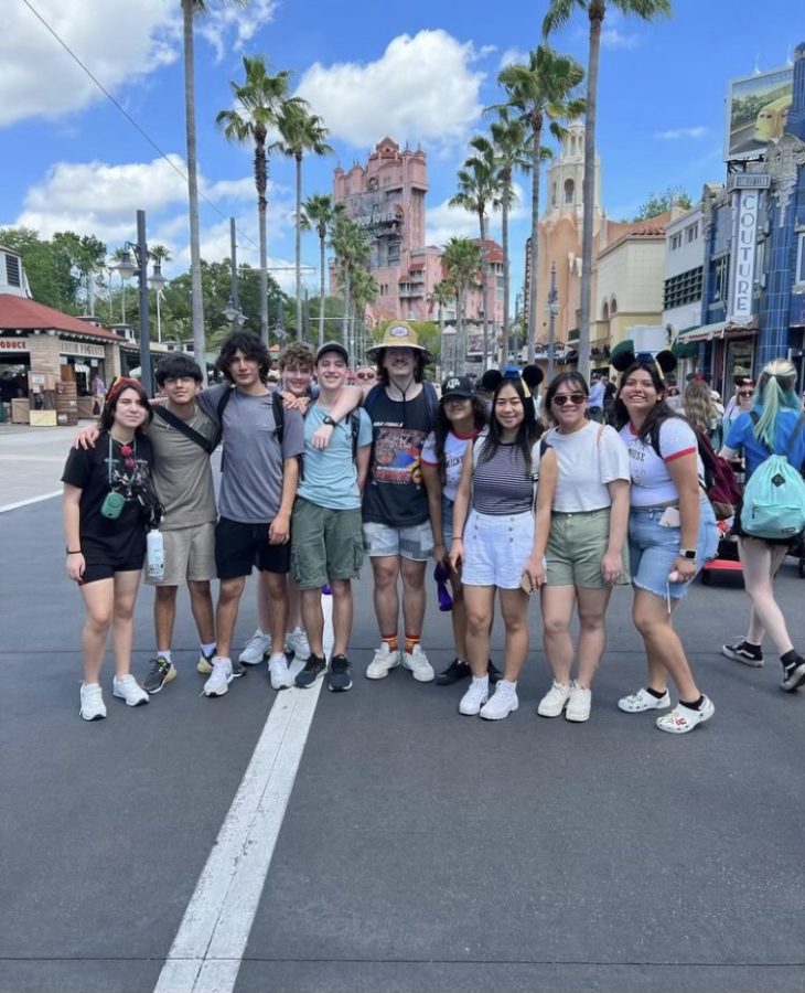 Members of the band pose for a picture in Hollywood Studios. One of the most popular rides in this park was the Tower of Terror.