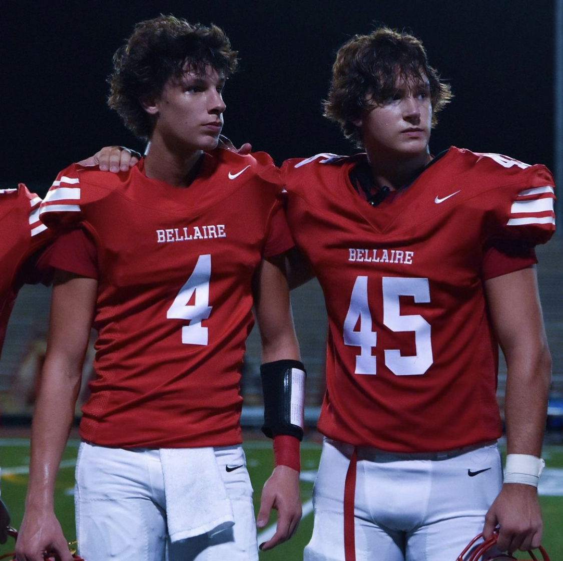 Brothers Will (left) and AJ (right) hugging during the Cardinal kick while the school song is played by the Mighty Cardinal Band. At the end of every game, the school song is played to show school pride and members of the cheer, football and Belles dance and sing together.