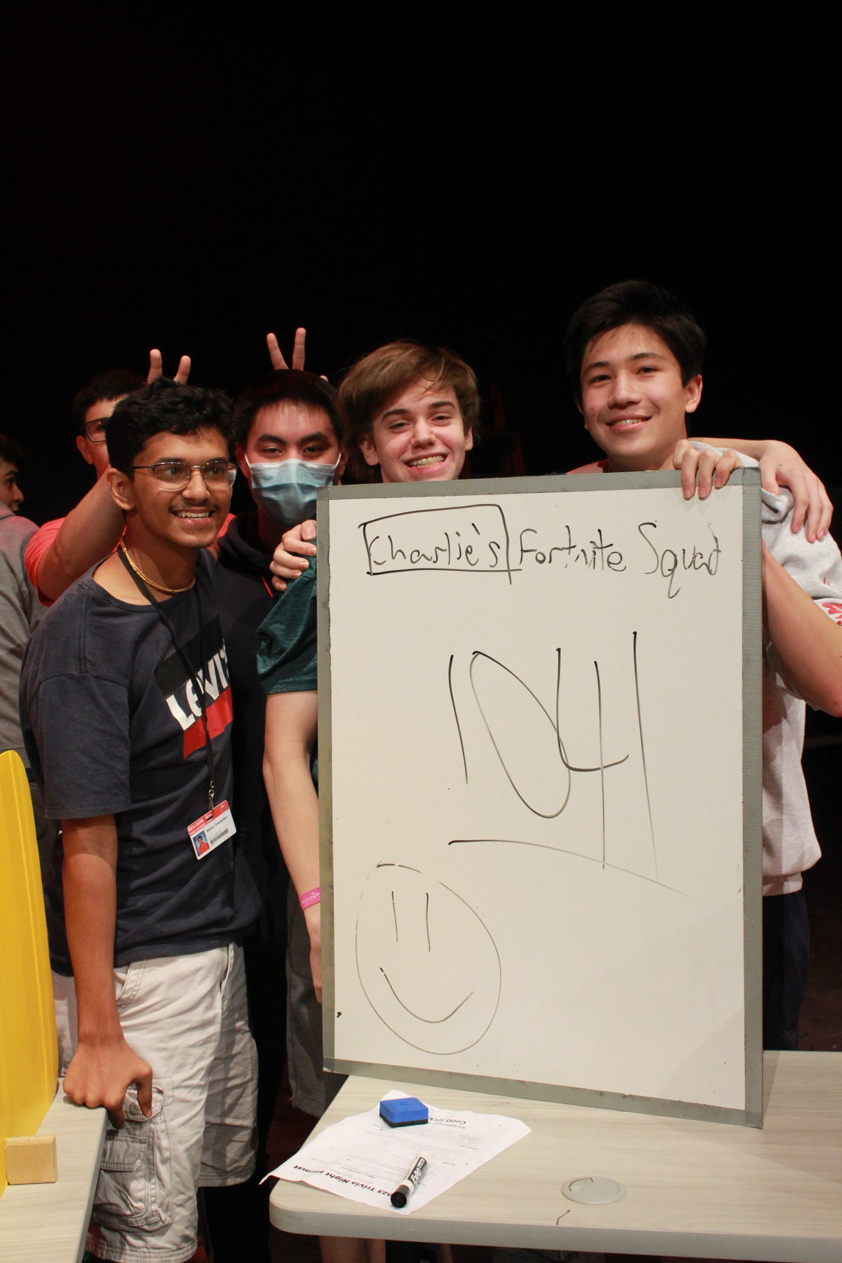 (left to right) Senior Sreedathan Menon, junior Vincent Lin, junior Weston Benner and junior Andrew Sazykin celebrate their victory at STUCOs trivia night on Nov. 9. They just barely beat the team of history teachers by one point.